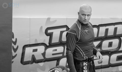  /></p><p>Of course, Half Guard offers an interesting paradox. John coaches his students to pass both Closed Guard and Open Guard and get to Half Guard to begin passing. So why, then if Half Guard is such a tough position, would he try to be on the “wrong side” of it while passing.</p><p>The answer lies in understanding it and because Half Guard is a position that so emphasizes the connection between the two combatants, understanding is key – whether on the bottom or top. It is an advantage to be in Half Guard: whether on top or bottom, when you understand the body mechanics, position and sequences you need to win the position.</p><p>This series focuses exclusively on the bottom player in greater detail than anyone has ever gone. Over 8 Hours of Content!</p><p><img src=